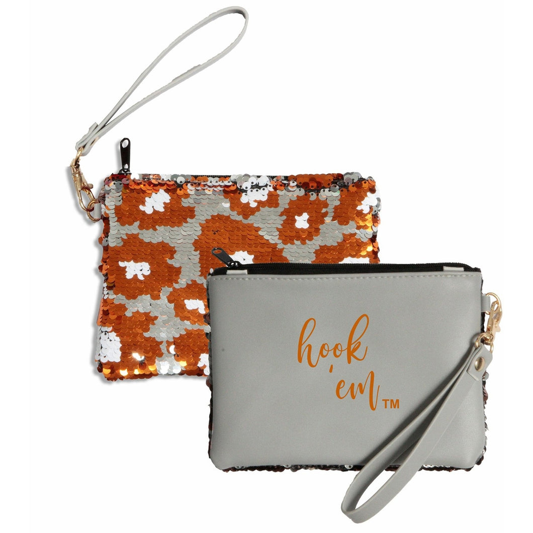 Small handheld purse, double sided. First side grey with orange letting HOOK EM and backside orange, black and white sparkles in cow print 