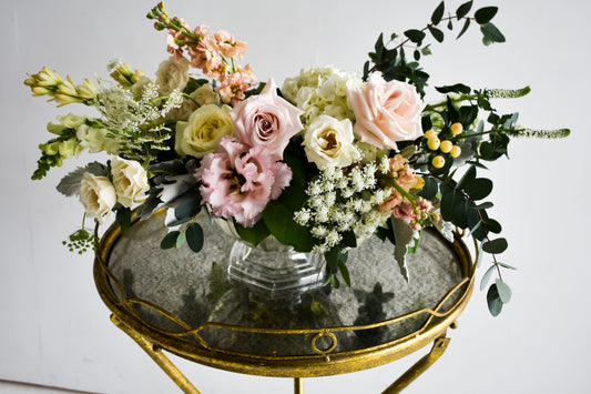 Fancy pale pink, pale green rose arrangement in clear vase